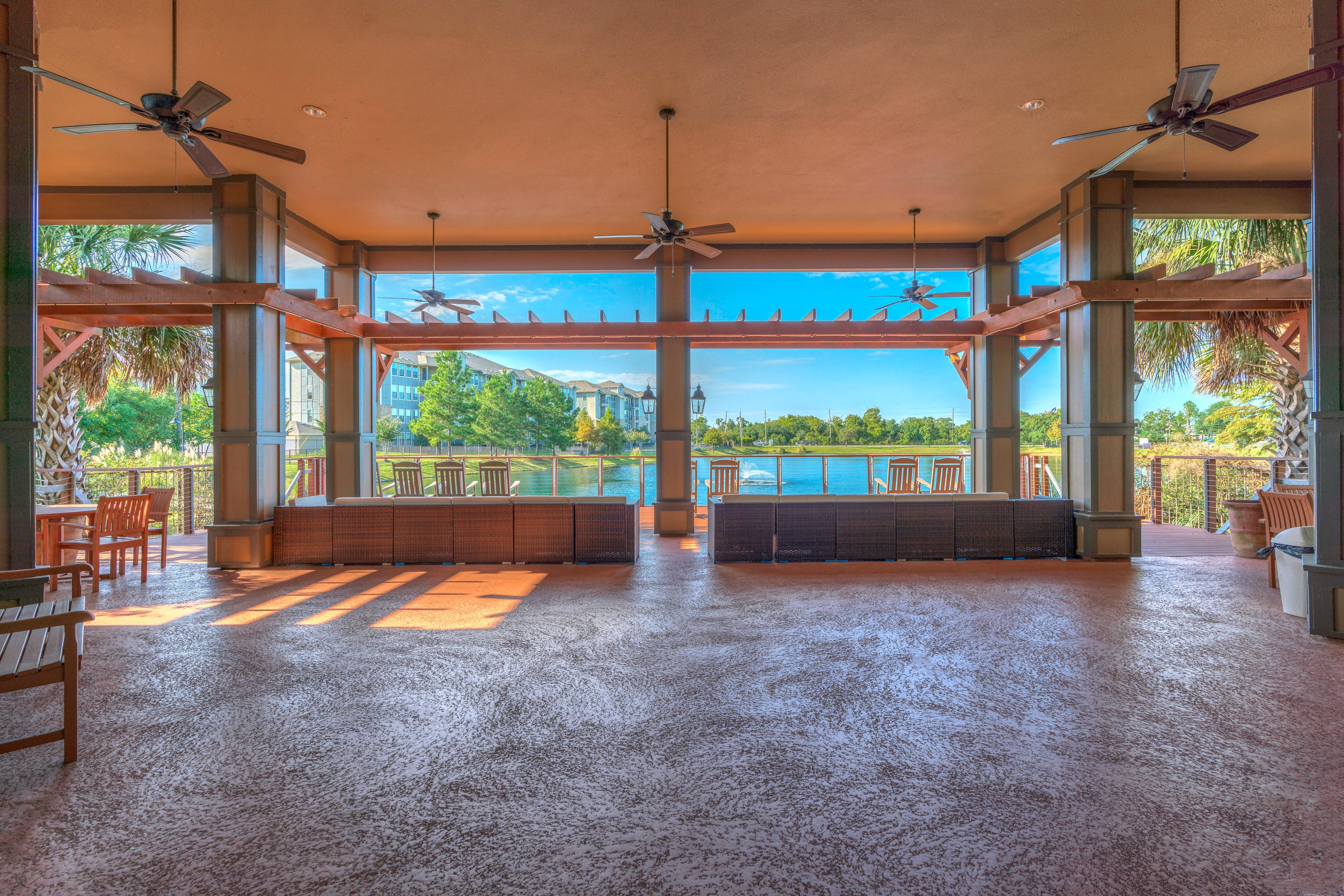 a large living room with a view of the water