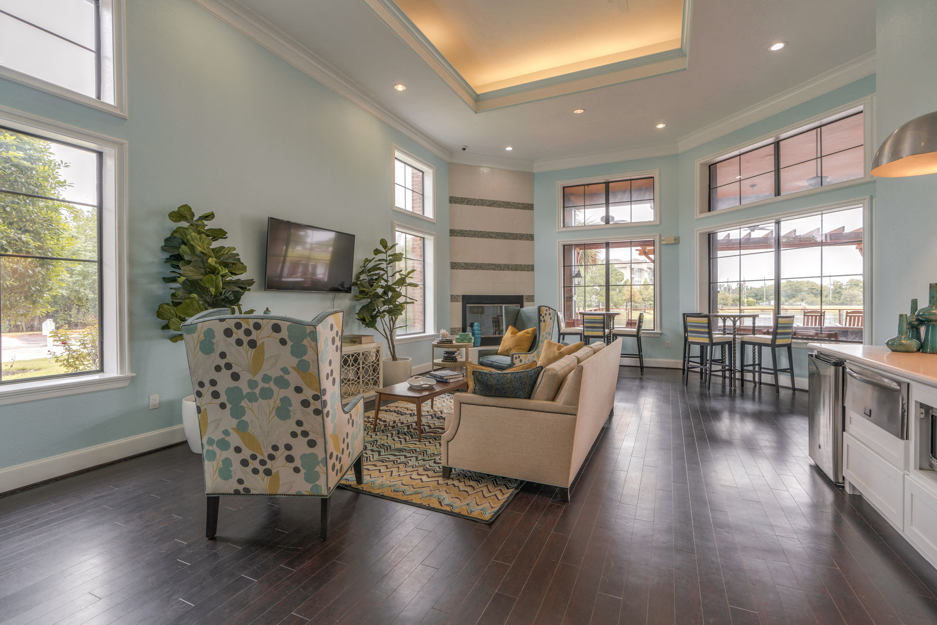 a living room with couches and chairs and a fireplace