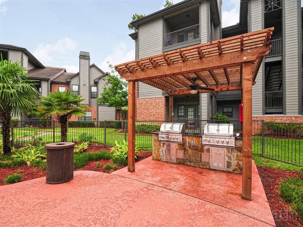 Spring TX Apartments for Rent - Edgewater at Klein - Outdoor Grill Area Shaded by a Pergola