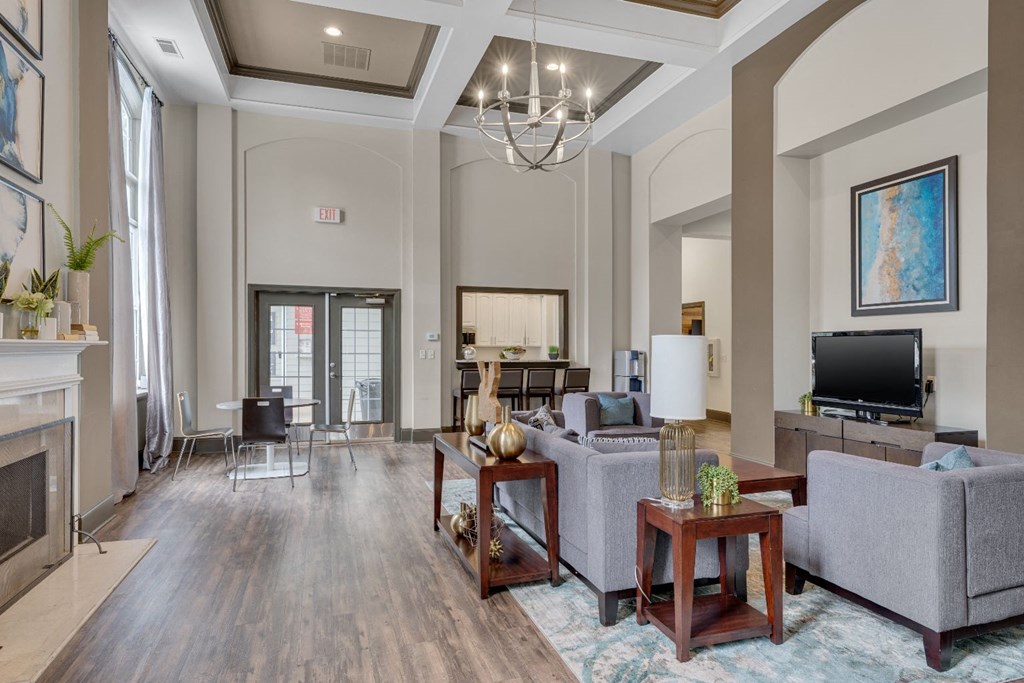 a spacious living room with a fireplace and a tv