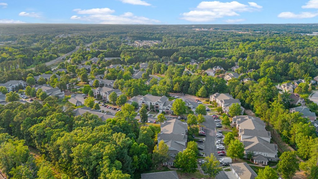 an aerial view of a neighborhood with houses and trees