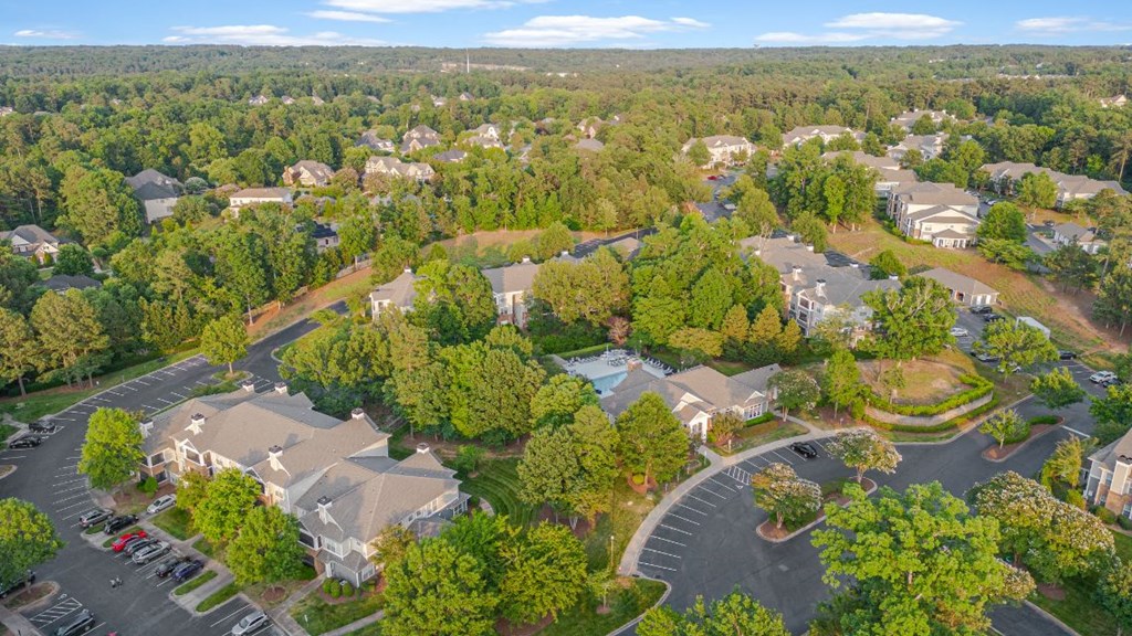 an aerial view of a neighborhood with houses and trees