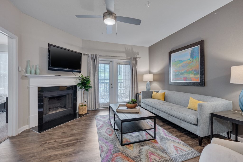 a living room with a fireplace and a couch