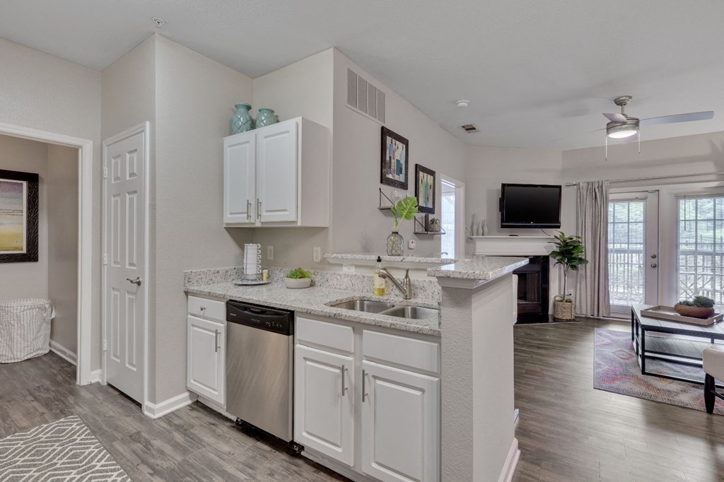 the preserve at ballantyne commons apartments clubhouse with kitchen and living room
