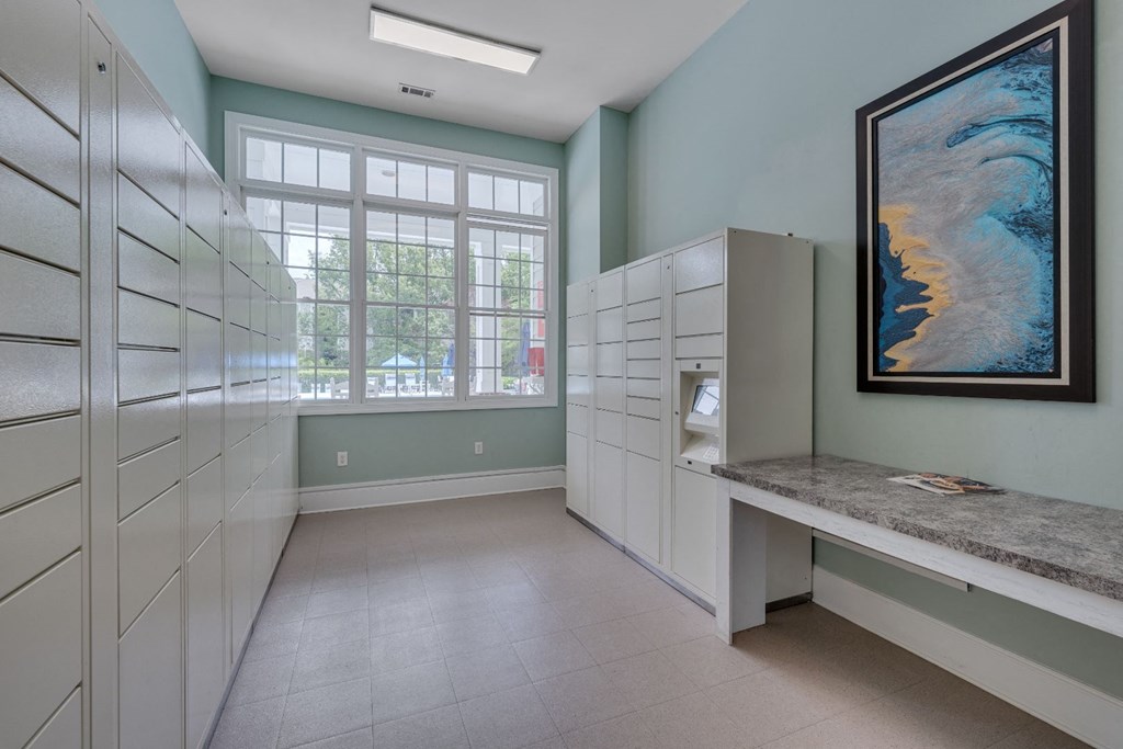 a storage room with white cabinets and a painting on the wall