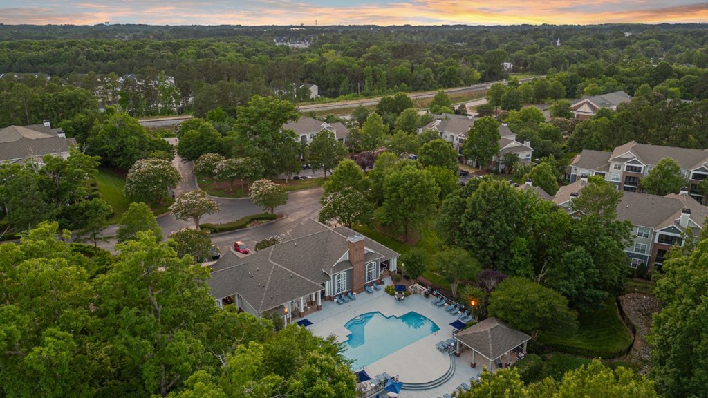 an aerial view of the resort style swimming pool and poolside amenities at the estates