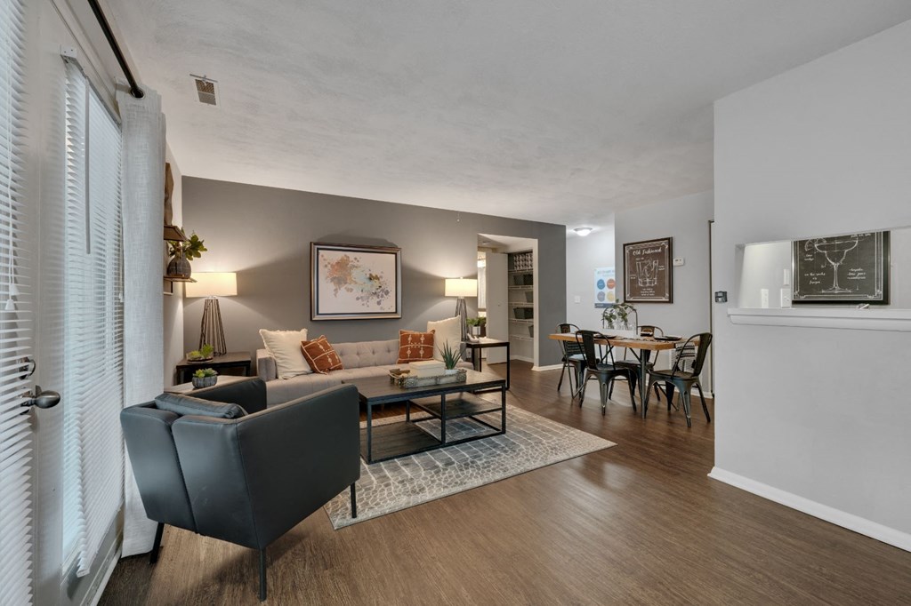 a living room and dining room with a couch and a table