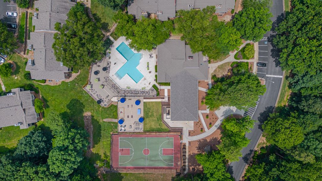 a birds eye view of a house with a tennis court on the roof