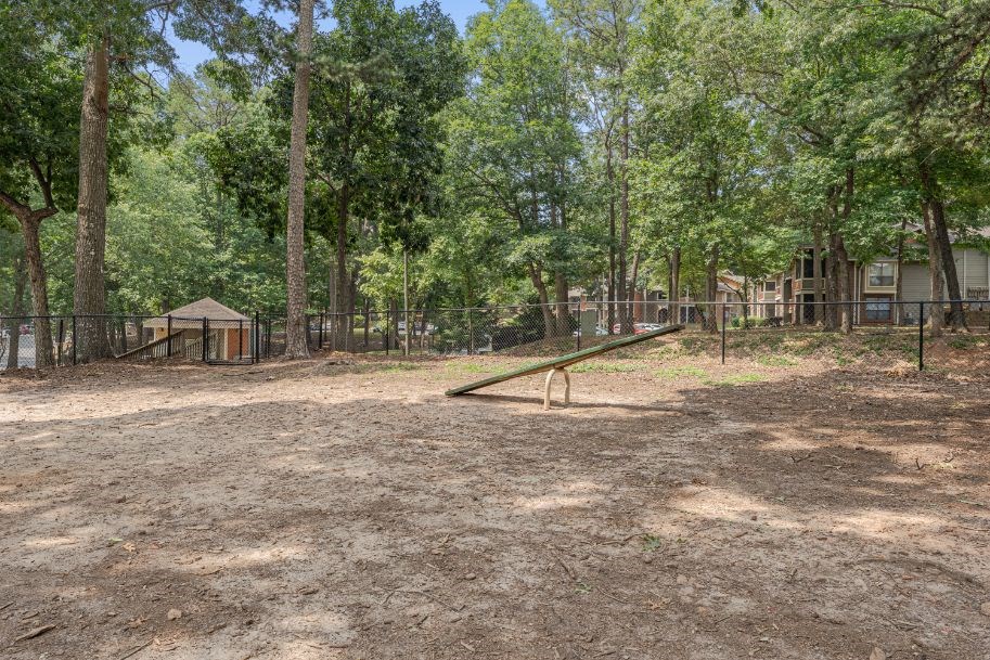 a park with a playground and trees