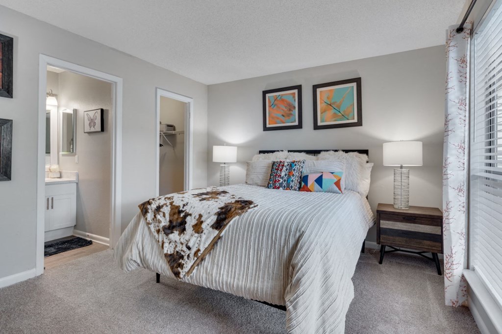 a bedroom with a bed and a closet