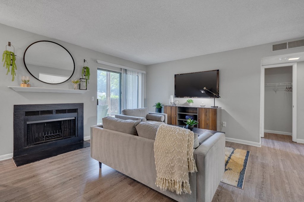 a living room with a couch and a fireplace