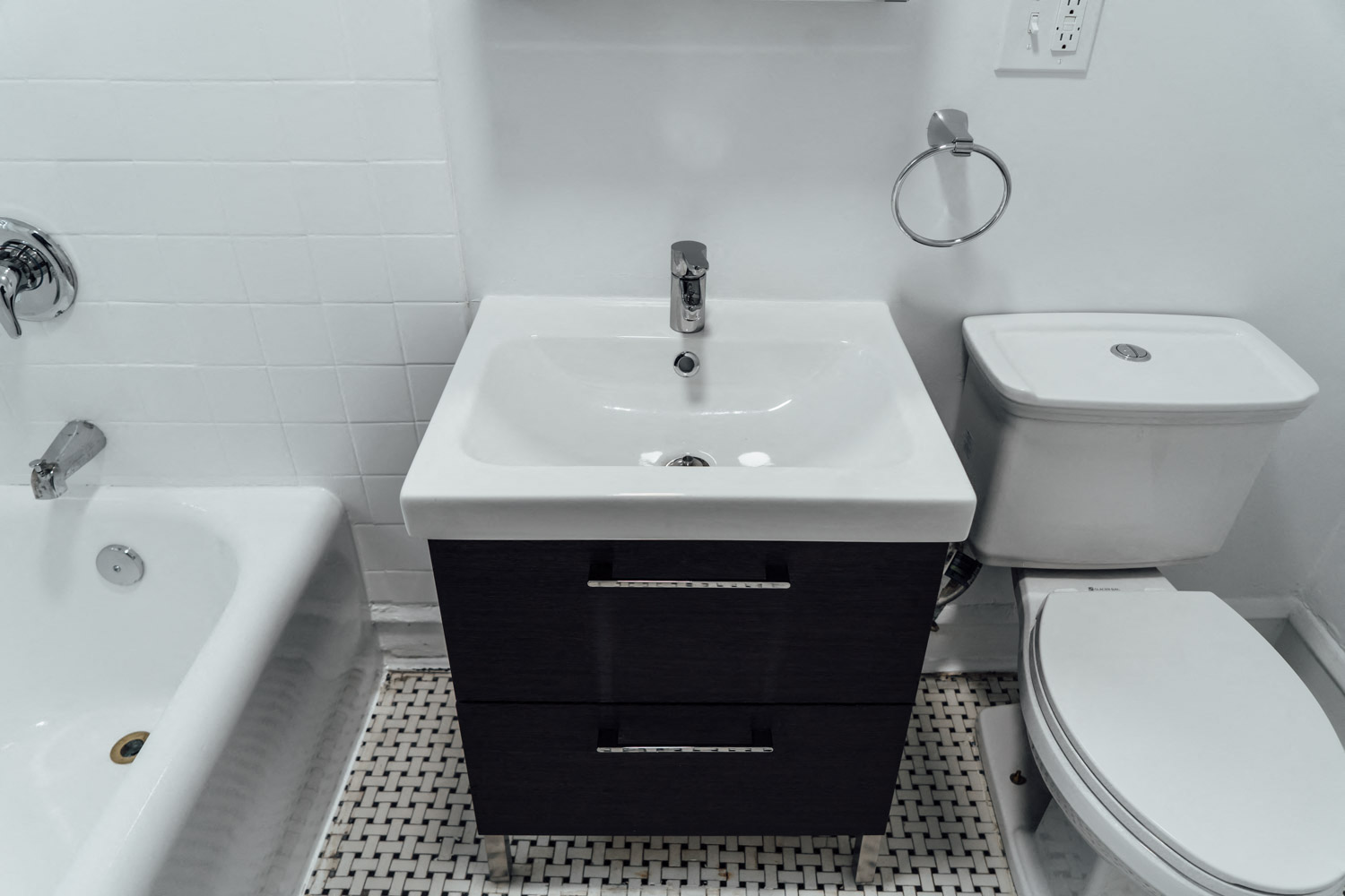 a bathroom with a sink toilet and a tub