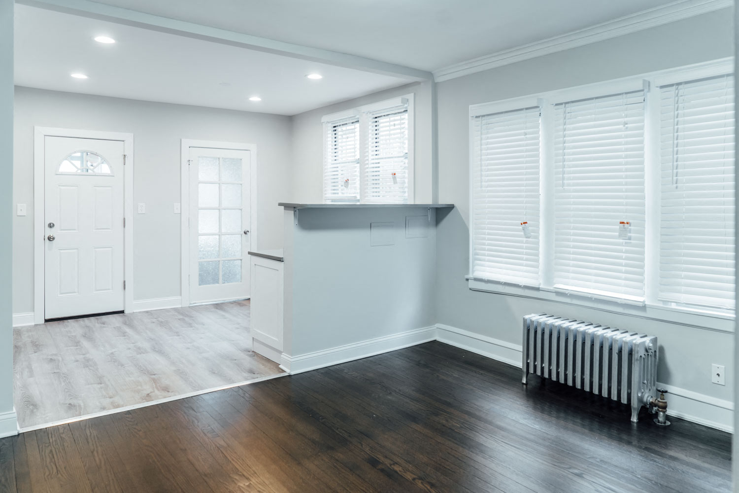 a living room with a radiator and a window