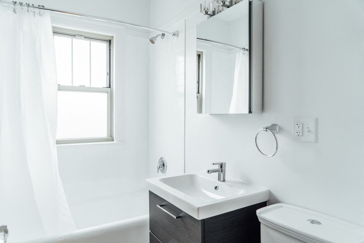 a bathroom with a sink and a mirror and a toilet