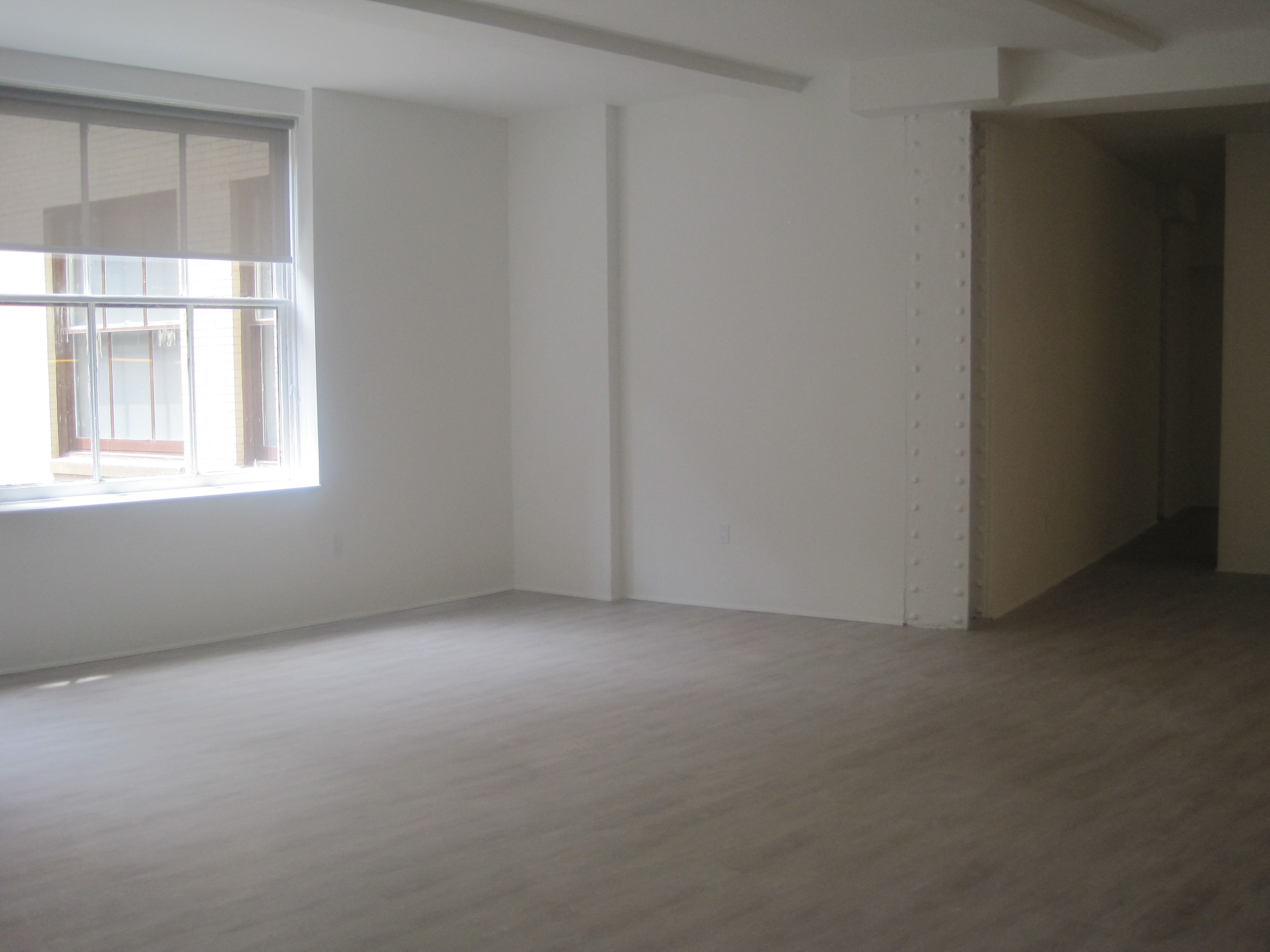 an empty room in a house with a window