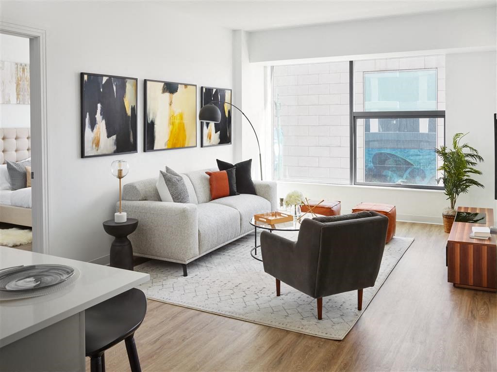 a living room with a couch and a chair