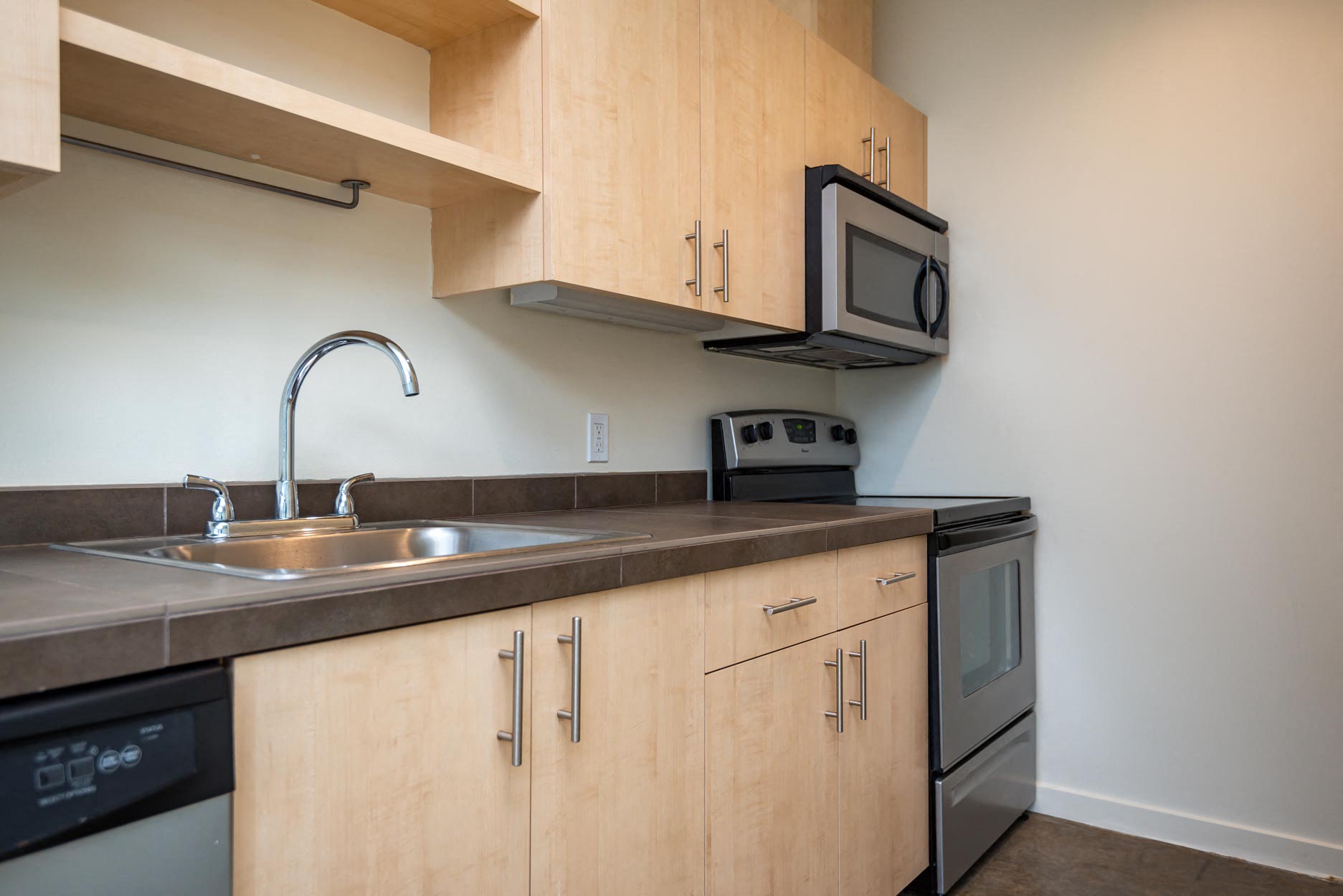 a kitchen with a sink and a microwave