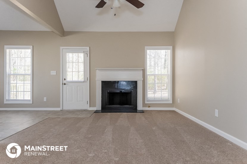 the living room of a home with a fireplace