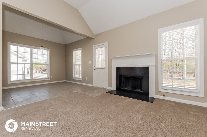 the living room of a home with a fireplace