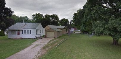 a row of houses in a neighborhood with trees