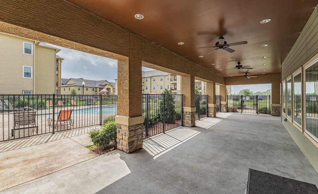 the preserve at ballantyne commons spacious balcony with pool and patio furniture