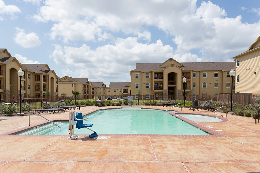 the preserve at ballantyne commons pool with apartment buildings
