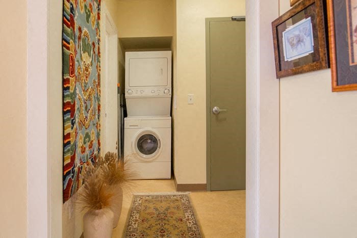 a washing machine and a dryer in a laundry room