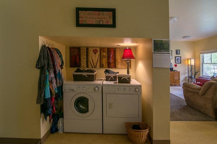 a laundry room with a washing machine in it
