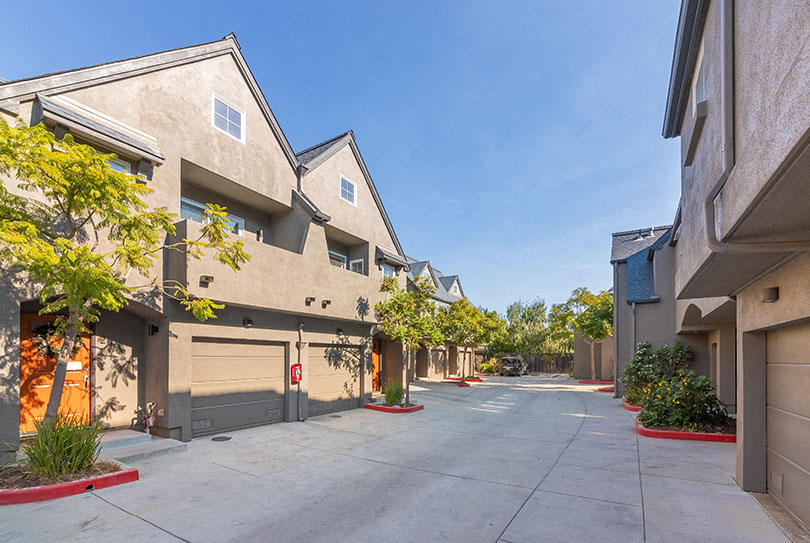 Exterior view of building and garages l 132 Clay Street Apartments