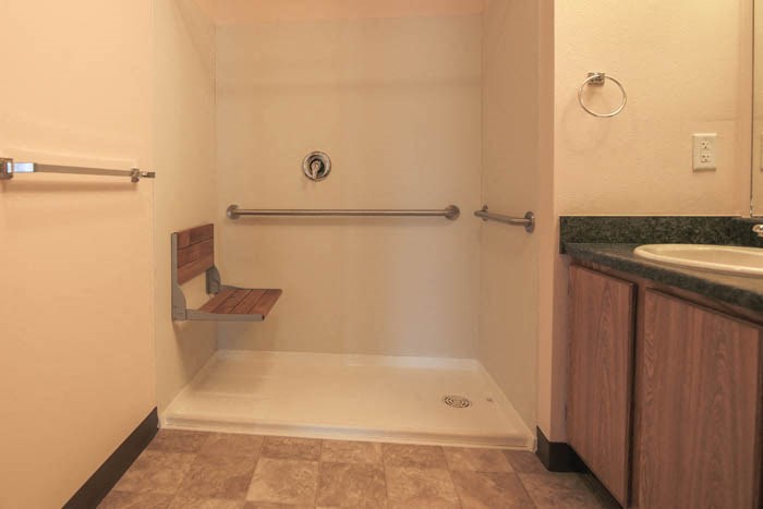 a small bathroom with a sink and a shower