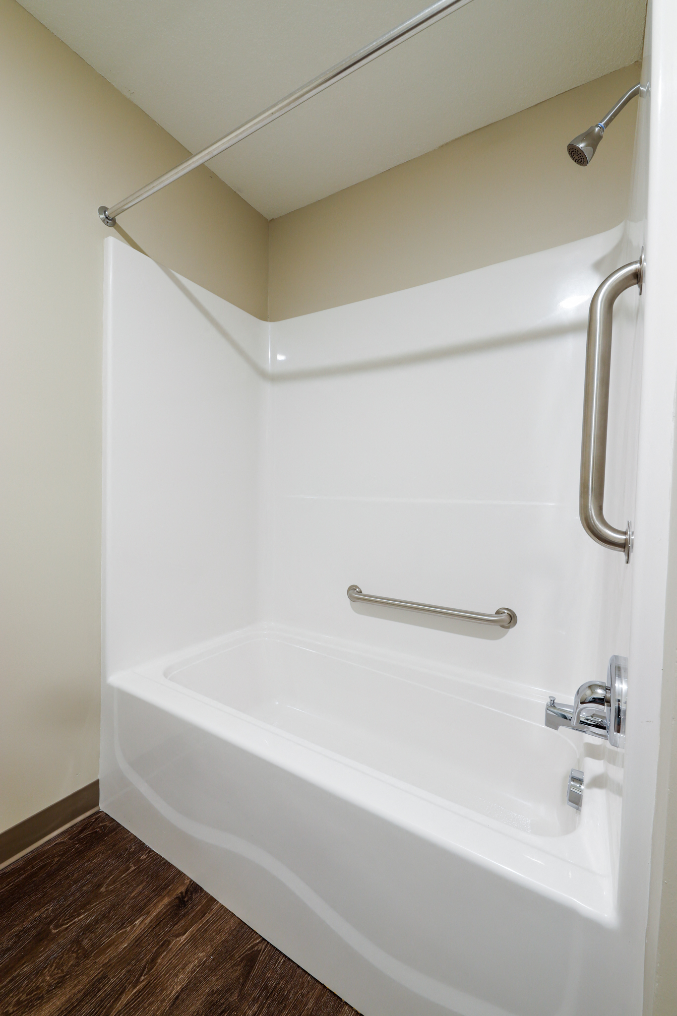 a small bathroom with a shower and a sink