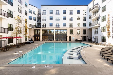 a swimming pool in the middle of an apartment building