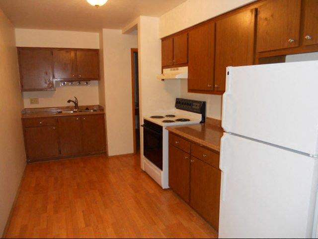 a kitchen with a stove and a refrigerator