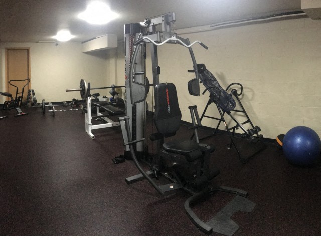 a gym with a lot of equipment in it