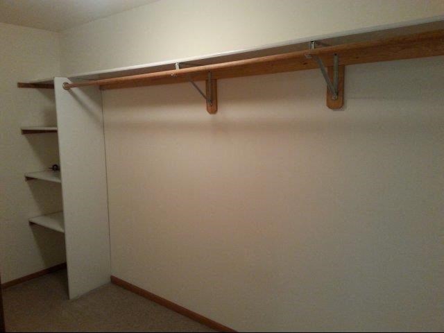 a room with a white wall and a sliding door