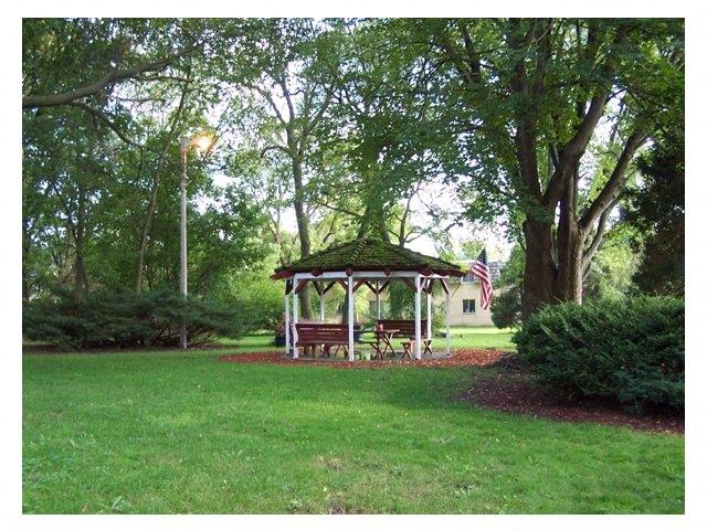 a gazebo in the middle of a park