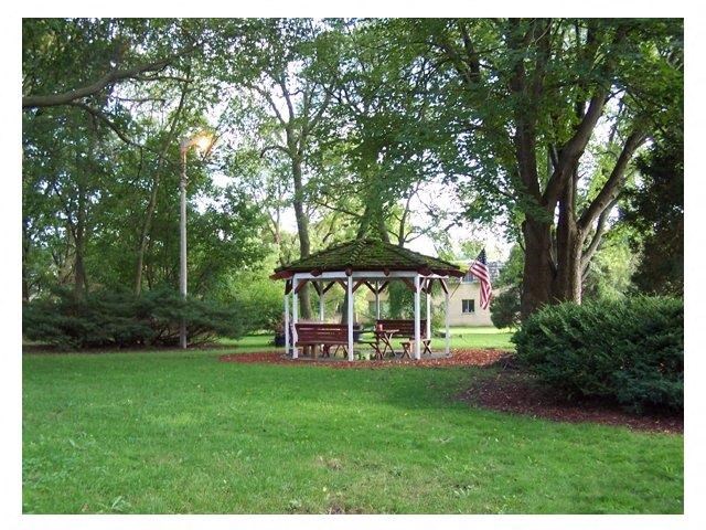 a gazebo in the middle of a park