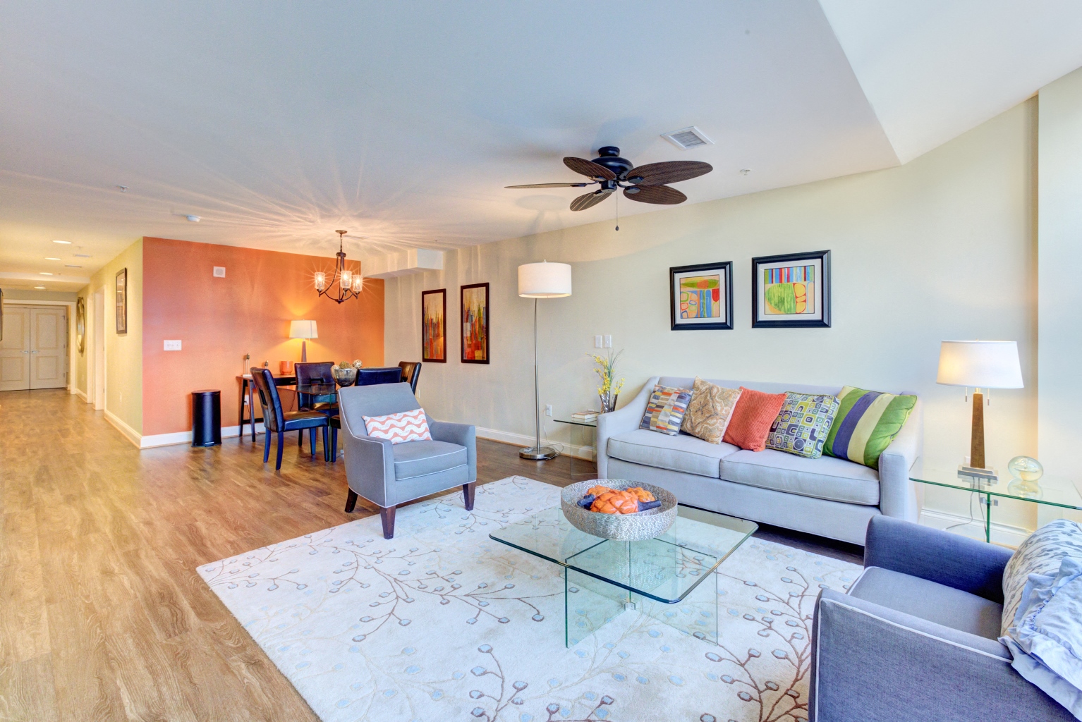 a living room with a couch and a glass table