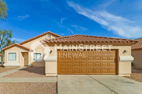 a house with a garage door with the word renewal on it
