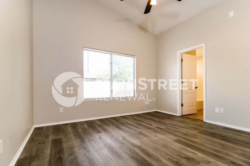 5995995 renovated living room with hard wood floor and large window