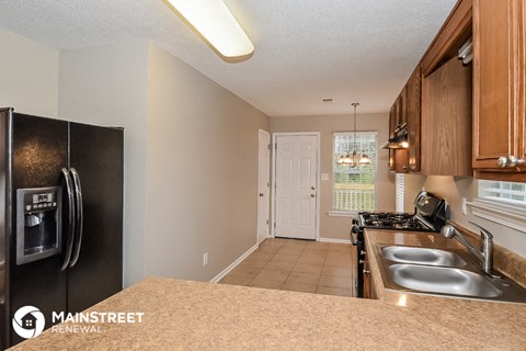 a kitchen with stainless steel appliances and a granite counter top