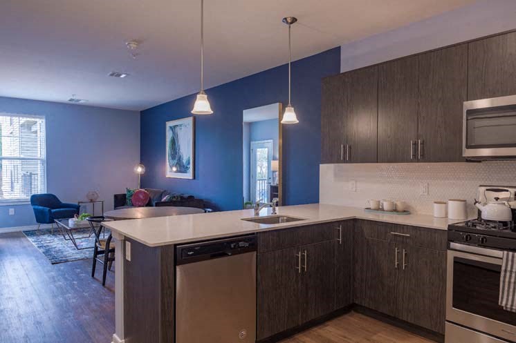 a kitchen and living room with blue walls