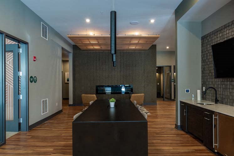 a living room with a table and a television