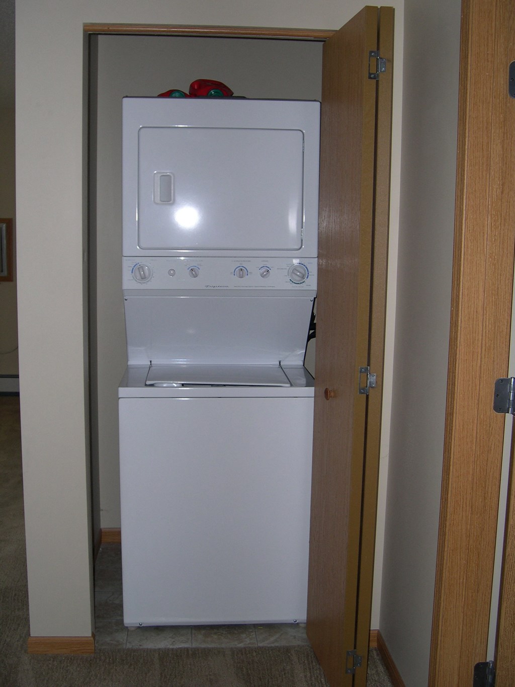 a washer and dryer in a closet in a hotel room