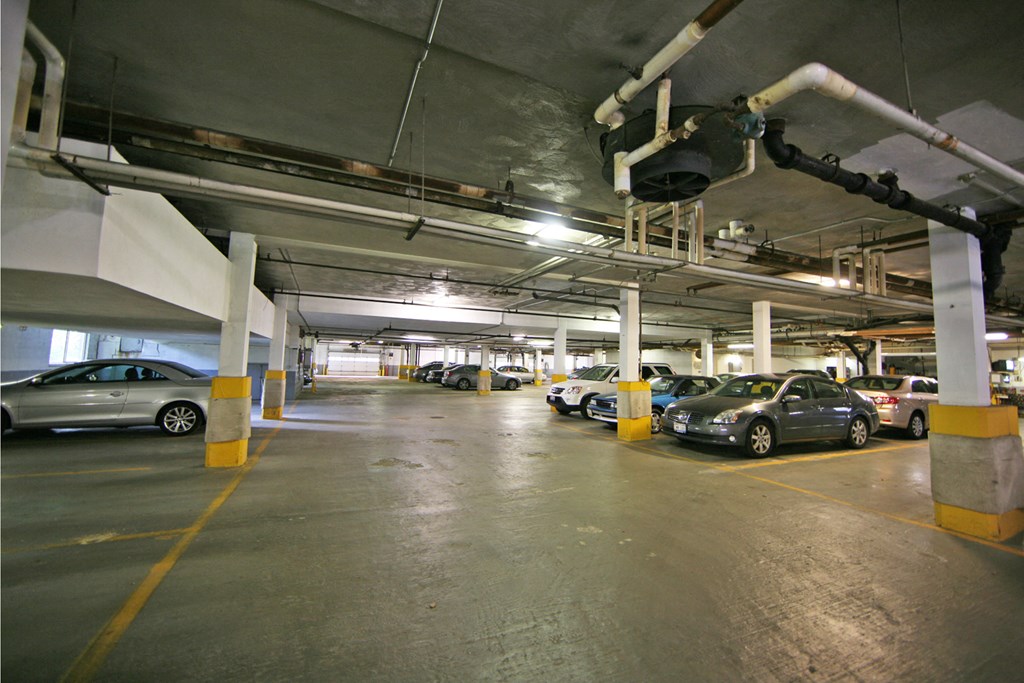 a parking garage with cars parked in it