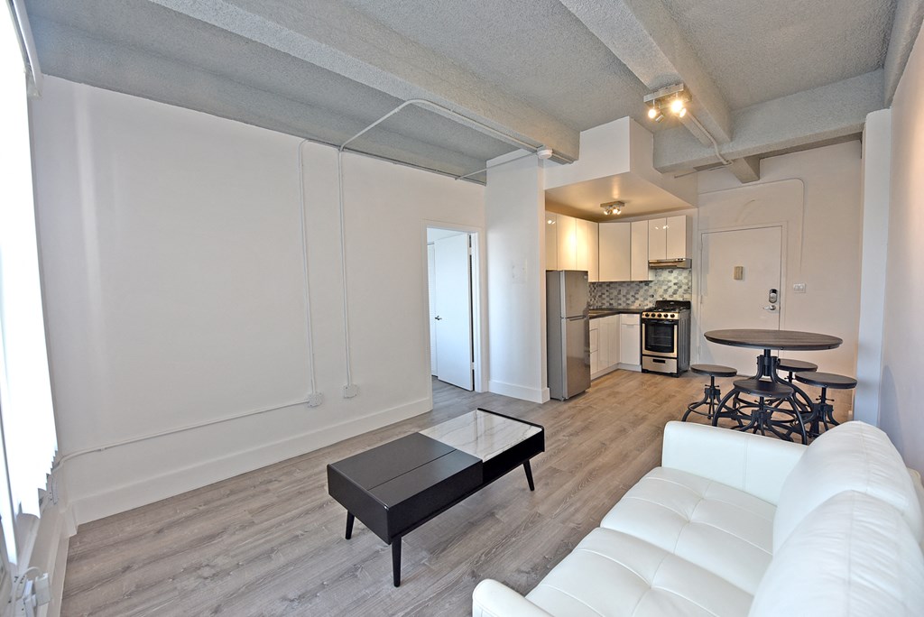 a living room with a white couch and a coffee table