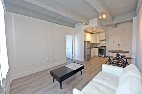 a living room with a white couch and a coffee table