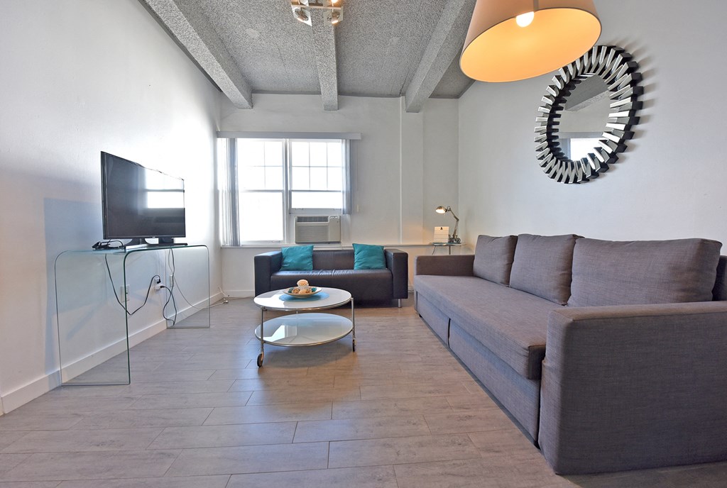 a living room with a couch and a tv