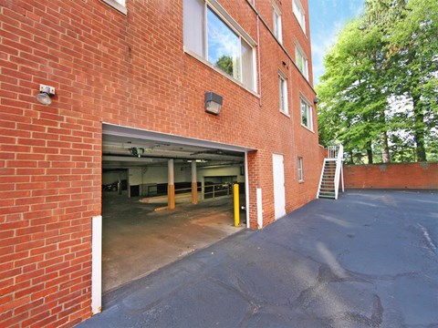 a large brick building with a parking garage