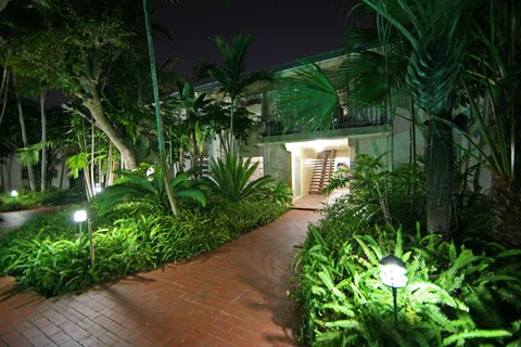 a path leading to a house at night